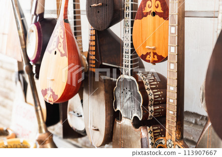 A variety of Central Asian stringed musical instruments are put up for sale A variety of Central Asian stringed musical instruments are put up for sale 113907667