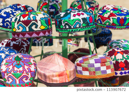 Tubeteika, a variety of Uzbek skullcaps are put up for sale at a street market 113907672