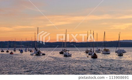 Bodensee Lake Sunset Panorama. Evening Sunlight Over Tranquil Waters. Sunset Vista at Lake Bodensee in Germany. Bodensee Lake Sunset Panorama. Evening Sunlight Over Tranquil Waters. Sunset Vista at Lake Bodensee in Germany. 113908691