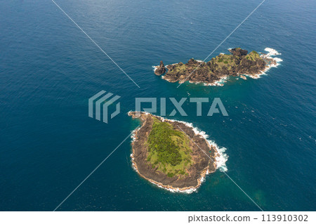 Top view of tropical island in the blue ocean. Dos Hermanos Island. Santa Ana, Cagayan. Philippines. 113910302