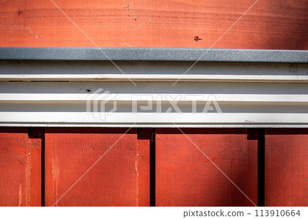 Wooden building details and construction. Red and white color. Metal parts 113910664