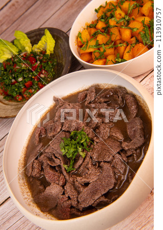 LEBANESE RECIPE, SHAWARMA, SPICY BEEF AND POTATOES, BATTATA HARA, GARLIC, CORIANDER AND PAPRIKA AND 113910757