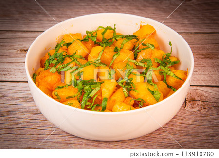 LEBANESE RECIPE FOR SPICY POTATOES, BATTATA HARA, GARLIC, CORIANDER AND PAPRIKA 113910780