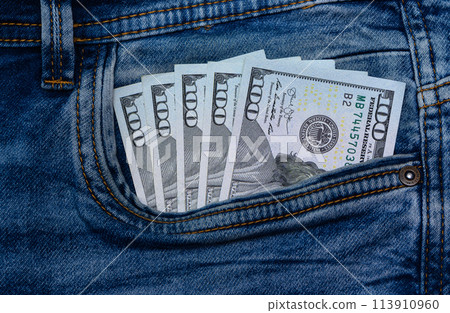 dollars bills lies in jeans pocket.money in wallet.savings.cash.international currency. 1 113910960