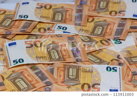many 50 euro bills close-up mixed haphazardly 2 many 50 euro bills close-up mixed haphazardly 2 113911003