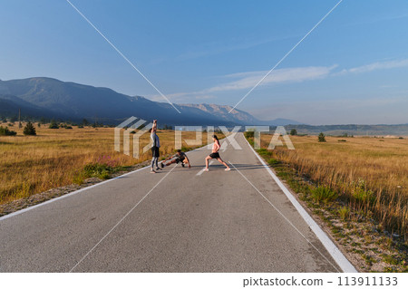 Diverse Athletes Prepare: Dynamic Group Warms Up for Morning Run. 113911133