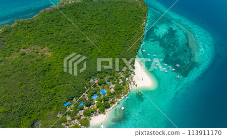 Aerial drone of coast of the island with a beautiful beach and palm trees. Virgin Island, Philippines. Aerial drone of coast of the island with a beautiful beach and palm trees. Virgin Island, Philippines. 113911170