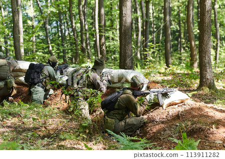 A disciplined and specialized military unit, donned in camouflage, strategically patrolling and maintaining control in a high-stakes environment, showcasing their precision, unity, and readiness for 113911282