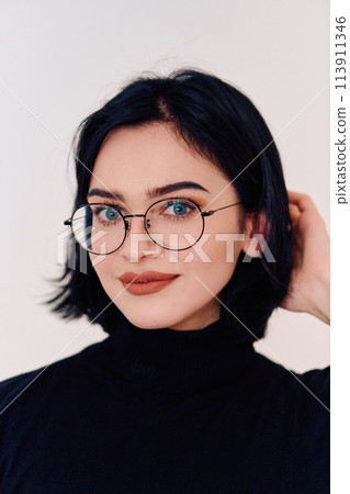 Smiling Brunette Woman Wearing Eyeglasses Poses on White Background 113911346