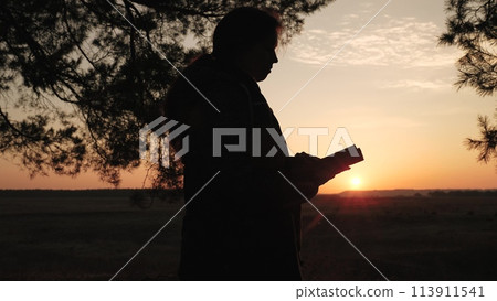 girl woman praying at sunset, hand sunset faith pain, asking heaven for help, bible book, young adult prayer, devout sunset reflection, peaceful prayer session, solitude prayer evening, spiritual girl woman praying at sunset, hand sunset faith pain, asking heaven for help, bible book, young adult prayer, devout sunset reflection, peaceful prayer session, solitude prayer evening, spiritual 113911541