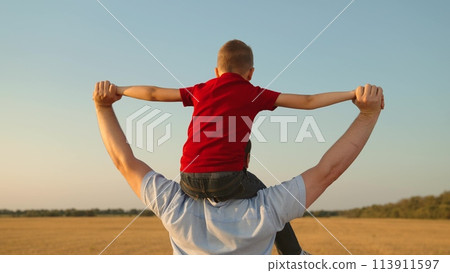 happy family father son child kid baby flight pilot superhero sky dream, kid pretending to fly, father son relationship, pretend pilot play, little aviator dream, family outside activity, male bonding 113911597