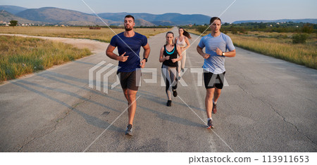A group of friends maintains a healthy lifestyle by running outdoors on a sunny day, bonding over fitness and enjoying the energizing effects of exercise and nature A group of friends maintains a healthy lifestyle by running outdoors on a sunny day, bonding over fitness and enjoying the energizing effects of exercise and nature 113911653