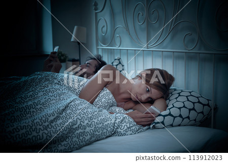 Problems in relationship, couple in bed 113912023