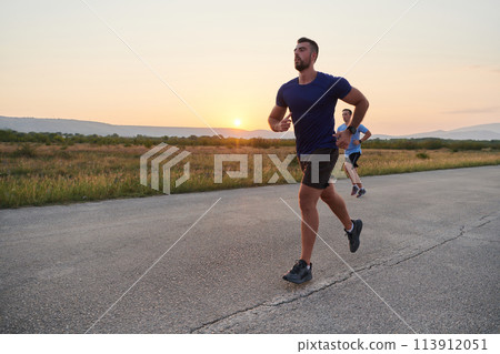 Marathon Partners: Two Athletic Friends Training Together for Upcoming Competition. Marathon Partners: Two Athletic Friends Training Together for Upcoming Competition. 113912051