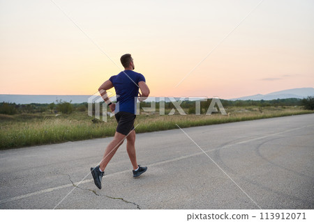 A dedicated marathon runner pushes himself to the limit in training. 113912071