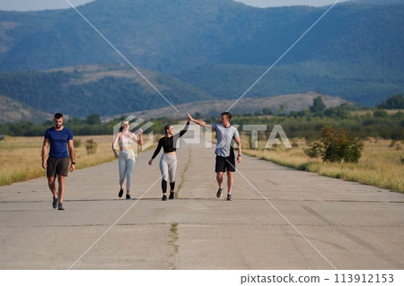 Diverse Athletic Warm-Up: Group Prepares for Intense Running Challenge. 113912153