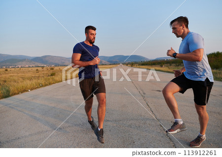Marathon Partners: Two Athletic Friends Training Together for Upcoming Competition. Marathon Partners: Two Athletic Friends Training Together for Upcoming Competition. 113912261