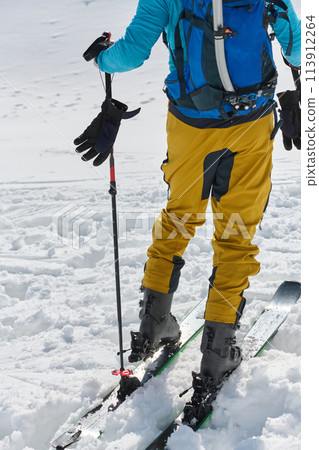 Close-Up of Ski Gear Ready for a Challenging Ascent 113912264