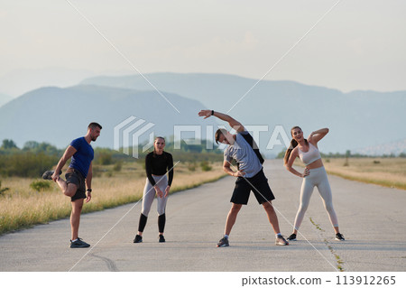 Diverse Group of Athletes Prepare Together for a Run 113912265
