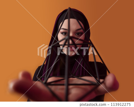 Muslim woman wearing modern stylish wear and hijab isolated on grey background. Diverse people model hijab fashion concept. Face recognition and biometric data identify face science. Muslim woman wearing modern stylish wear and hijab isolated on grey background. Diverse people model hijab fashion concept. Face recognition and biometric data identify face science. 113912275