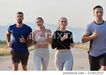 A group of friends maintains a healthy lifestyle by running outdoors on a sunny day, bonding over fitness and enjoying the energizing effects of exercise and nature A group of friends maintains a healthy lifestyle by running outdoors on a sunny day, bonding over fitness and enjoying the energizing effects of exercise and nature 113912537