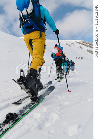 Close-Up of Ski Gear Ready for a Challenging Ascent 113912840