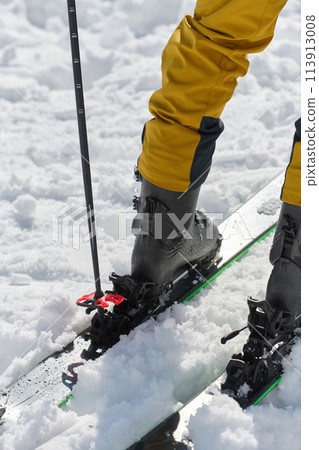Close-Up of Ski Gear Ready for a Challenging Ascent 113913008
