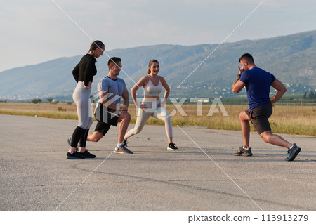 Diverse Group of Athletes Prepare Together for a Run 113913279