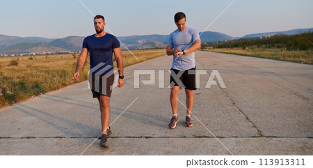 Marathon Partners: Two Athletic Friends Training Together for Upcoming Competition. Marathon Partners: Two Athletic Friends Training Together for Upcoming Competition. 113913311