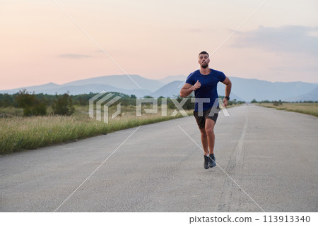 A dedicated marathon runner pushes himself to the limit in training. 113913340