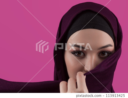 Modern Muslim woman wearing stylish hijab casual wear isolated on pink background. Diverse people model hijab fashion concept. 113913425