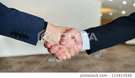 Businessmen making handshake with partner, greeting, dealing, merger and acquisition, business joint venture concept, for business, finance and investment background, teamwork and successful business 113913588