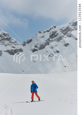 A Skier Scales a Treacherous Alpine Peak A Skier Scales a Treacherous Alpine Peak 113913594