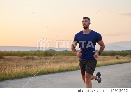 A dedicated marathon runner pushes himself to the limit in training. 113913612