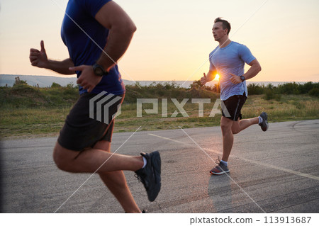 Marathon Partners: Two Athletic Friends Training Together for Upcoming Competition. Marathon Partners: Two Athletic Friends Training Together for Upcoming Competition. 113913687