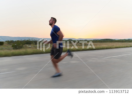 A dedicated marathon runner pushes himself to the limit in training. 113913712