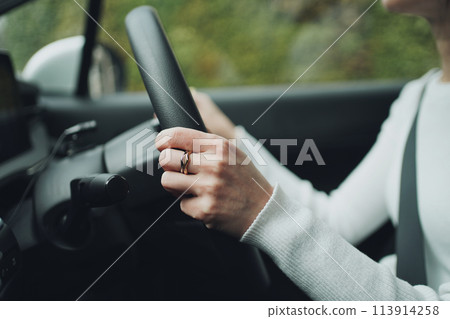 Woman's hands driving Woman's hands driving 113914258