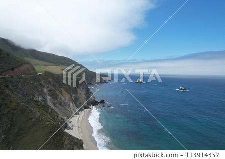 Windswept cliffs and Pacific ocean from Highway one Calfifornia Windswept cliffs and Pacific ocean from Highway one Calfifornia 113914357