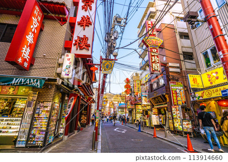 Yokohama cityscape in Japan in April. View of Yokohama Chinatown and Guandi Temple Street. In the background are Ten-Nagato and Yokohama Daisekai (14th) Yokohama cityscape in Japan in April. View of Yokohama Chinatown and Guandi Temple Street. In the background are Ten-Nagato and Yokohama Daisekai (14th) 113914660