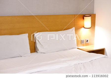 white pillow on bed white pillow on bed 113916002