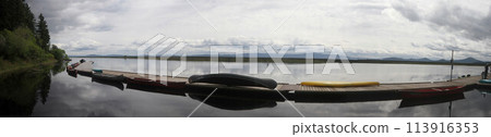 Boats in a marina on a lake 113916353