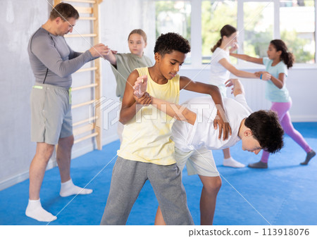 Two boys practicing self-defense techniques 113918076