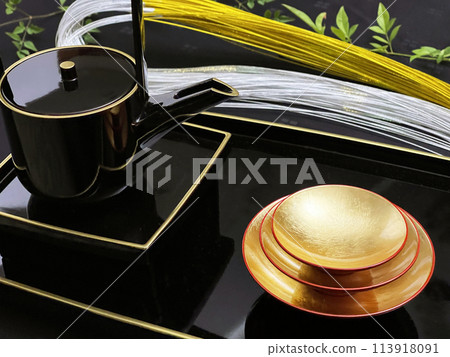 A traditional Japanese golden celebratory cup and gold and silver celebratory cord used at weddings and Shinto ceremonies. A traditional Japanese golden celebratory cup and gold and silver celebratory cord used at weddings and Shinto ceremonies. 113918091