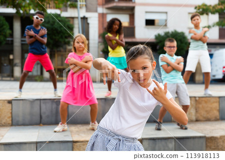 Young boys and girls dancing outdoors Young boys and girls dancing outdoors 113918113