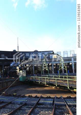 Turntable and steam locomotive, C61 No. 2, vehicle number C612, and blue sky Turntable and steam locomotive, C61 No. 2, vehicle number C612, and blue sky 113918365