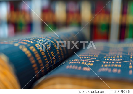 close-up of a cryptocurrency exchange order book. The book is informative and dynamic, and there are other books in the background 113919036
