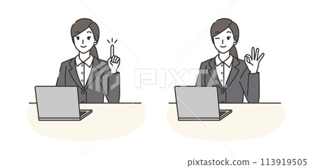 A woman in a suit pointing at a computer and making an OK pose 113919505