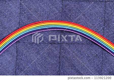 Denim quilted fabric background with rainbow Denim quilted fabric background with rainbow 113921200