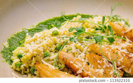 squids or octopus risotto with pesto sauce 113922310
