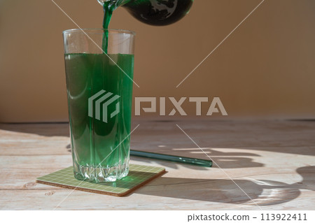 Organic blue-green algae spirulina detox drink in glass powder food. Health protein cocktail smoothie of chlorella. Vitamins and minerals to diet. Prebiotic and antioxidant rich Dietary supplement Organic blue-green algae spirulina detox drink in glass powder food. Health protein cocktail smoothie of chlorella. Vitamins and minerals to diet. Prebiotic and antioxidant rich Dietary supplement 113922411
